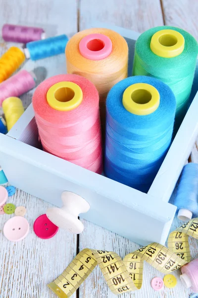 Sewing Accessories in wooden box on table close-up — Stock Photo, Image