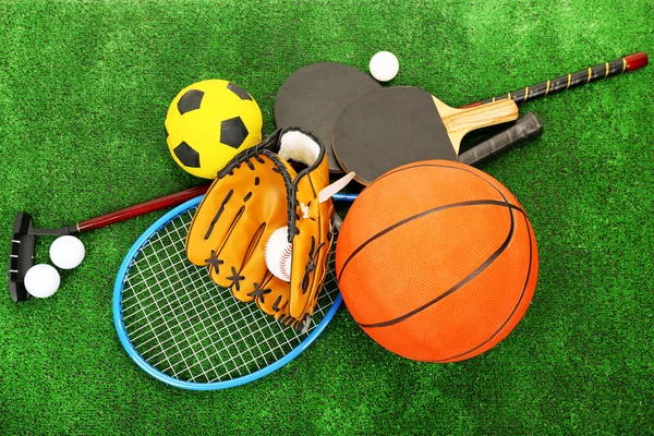 Sports equipment on grass background — Stock Photo, Image