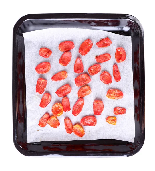 Sun dried tomatoes on drying tray, isolated on white — Stock Photo, Image
