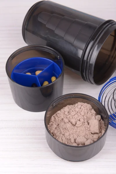 Empty protein powder container Stock Photo by ©michaklootwijk