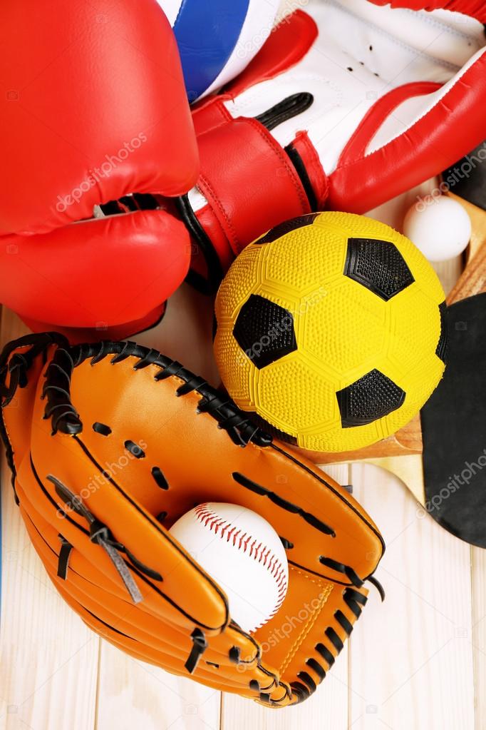 Sports equipment on wooden background