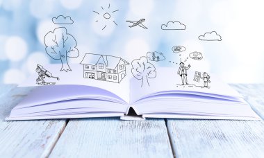 Açık kitap üzerine parlak arka plan ile