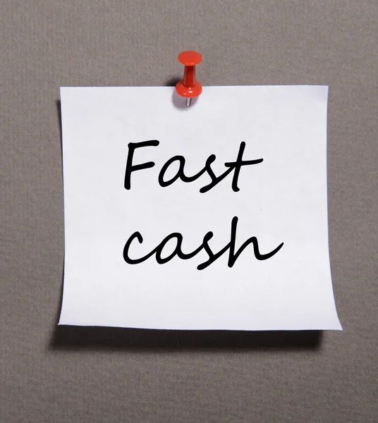 Papier blad met inscriptie "fast cash" op grijze achtergrond — Stockfoto