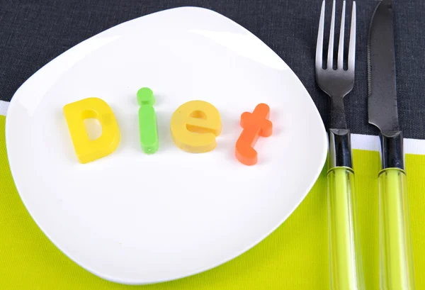 Plate with inscription on table close-up — Stock Photo, Image