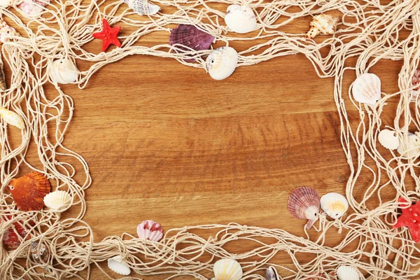 Seashells on wooden background — Stock Photo, Image