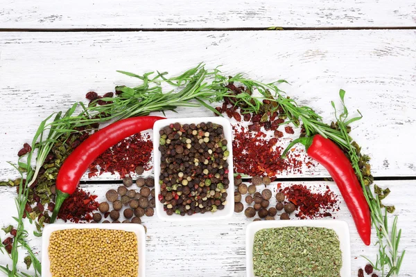 Spice with herbs and dried chilly pepper on wooden background — Stock Photo, Image