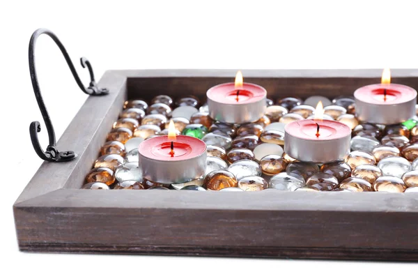 Kaarsen op vintage dienblad met decoratieve stenen, geïsoleerd op wit — Stockfoto