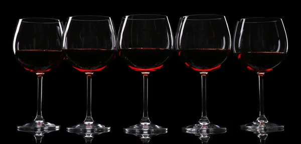 Glasses of wine isolated on black — Stock Photo, Image