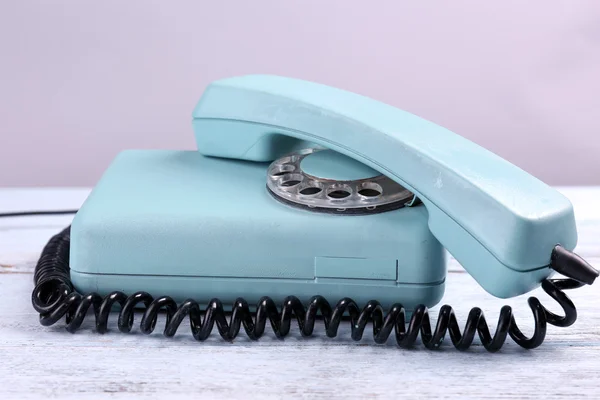 Retro turquoise telephone on wooden table, close up — Stock Photo, Image