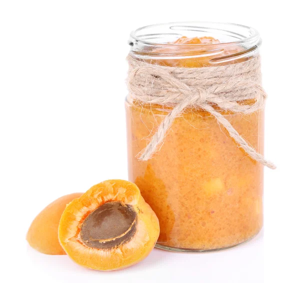 Tasty apricot jam with fresh apricots, isolated on white — Stock Photo, Image