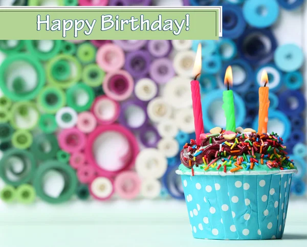 Delicious birthday cupcake on bright background — Stock Photo, Image