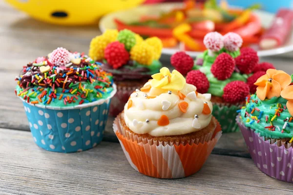 Delicious birthday cupcakes on table close-up — Stock Photo, Image