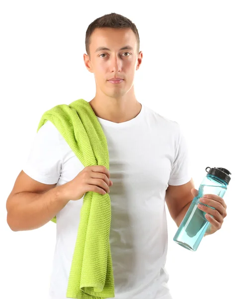 Schöner junger Sportler mit Handtuch und Flasche mit Wasser isoliert auf weiß — Stockfoto