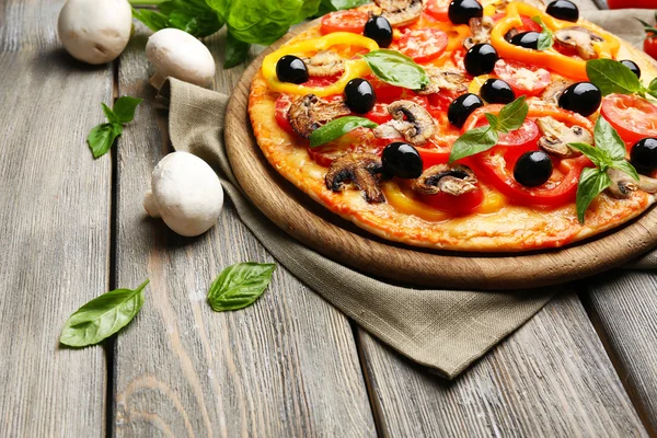 Delicious pizza on table — Stock Photo, Image