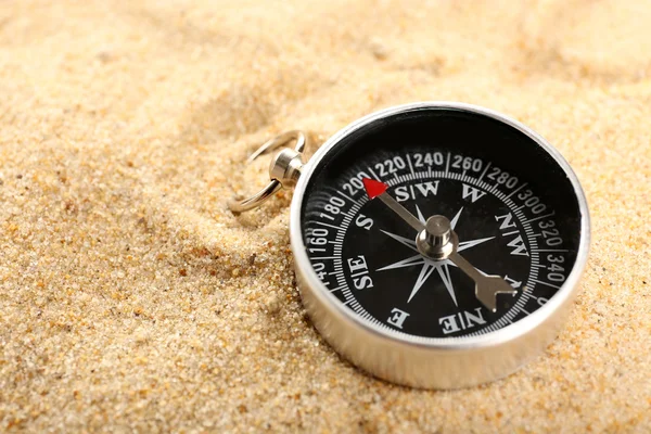 Compass on sand close-up — Stock Photo, Image