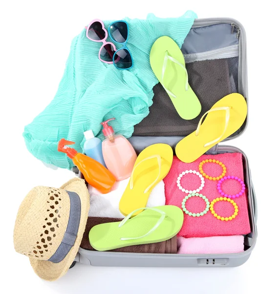 Suitcase with things for travelling somewhere close to water for spending summer vacation isolated on white — Stock Photo, Image