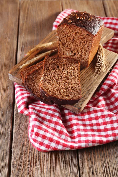 Fresh bread on wooden table, close up — Stock Photo, Image