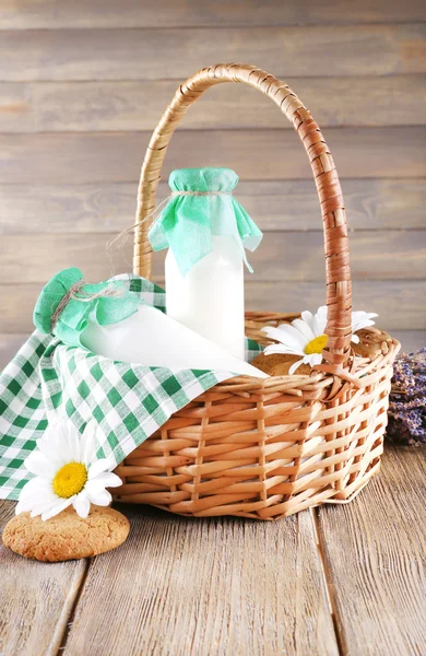 Tasty snack in basket on wooden background indoor — Stock Photo, Image