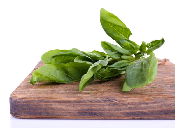 Tuft of fresh sorrel on wooden cutting board isolated on white — Stock Photo, Image