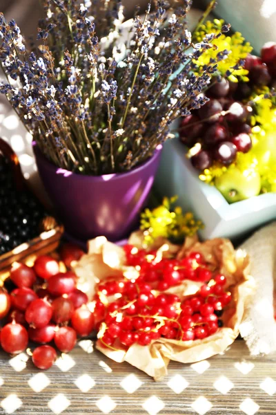 Still life with berries and flowers — Stock Image Still life with berries and flowers Stock Photo