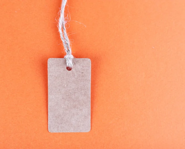Brown tag on colorful background — Stock Photo, Image