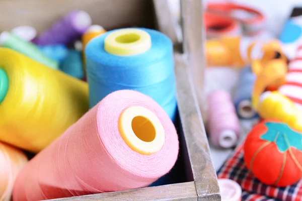 Sewing Accessories in wooden box on table close-up — Stock Photo, Image