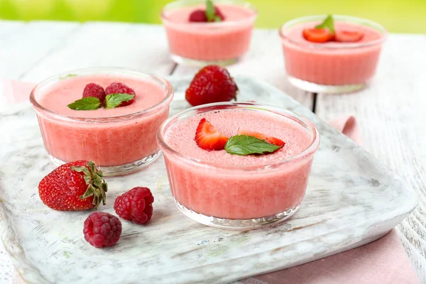 Delicious berry mousse in bowls on table close-up — Stock Photo, Image