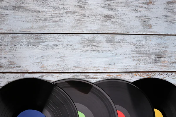 Records on paper bags on wooden background — Stock Photo, Image