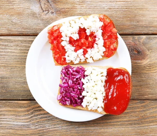 Sandwiches with  different flags on table close-up — Stock Photo, Image