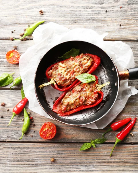 Delicious stuffed peppers in frying pan on table close-up Stock Photo