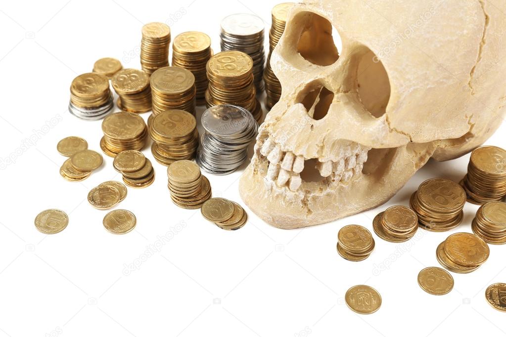 Human skull and coins