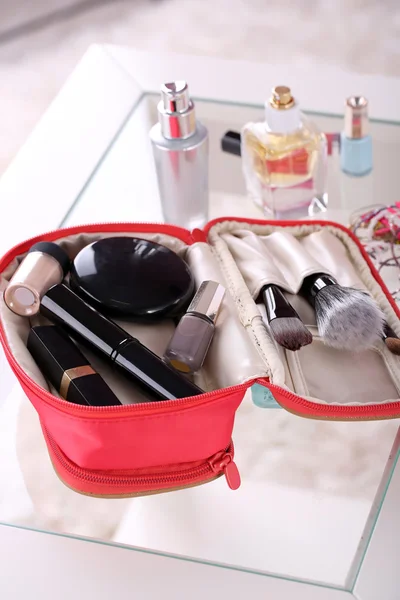 Cosmetic bag on table on light background — Stock Photo, Image