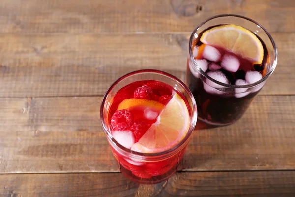 Glasses of cold berry cocktail on wooden background — Stock Photo, Image