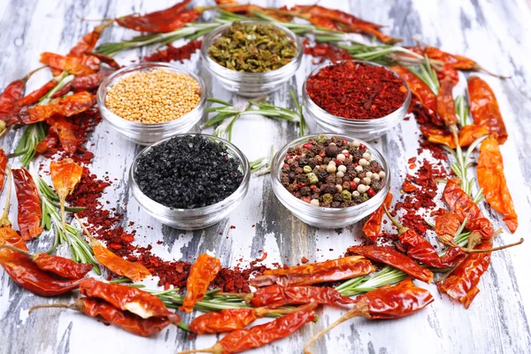 Spices with herbs and dried chilly pepper on wooden background — Stock Photo, Image