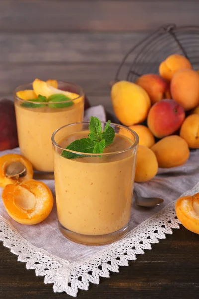 Apricot dessert in glasses on table close-up — Stock Photo, Image