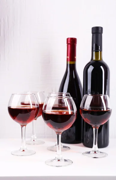 Glasses and wine bottle — Stock Photo, Image