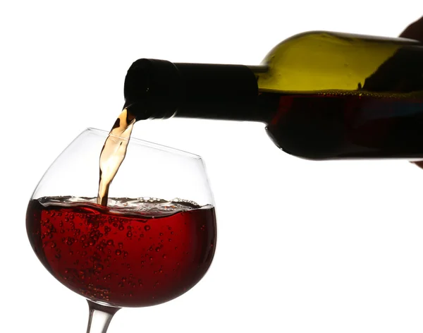 Red wine pouring into wine glass — Stock Photo, Image