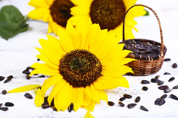 Sunflowers with seeds on table close-up — Stock Photo, Image