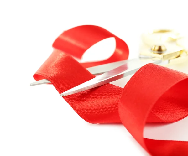 Red ribbon and scissors isolated on white — Stock Photo, Image