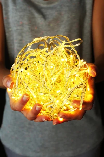 Woman holding garland — Stock Photo, Image