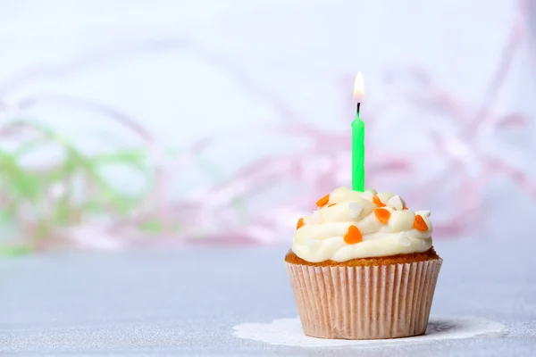 Delicious birthday cupcake on table on light background — Stock Photo, Image