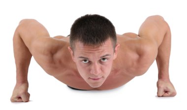 Yakışıklı genç kaslı sporcu yürütmek üzerinde beyaz izole egzersiz