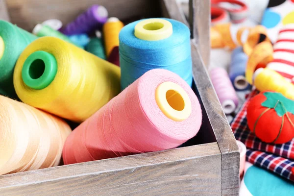 Sewing Accessories in wooden box on table close-up — Stock Photo, Image