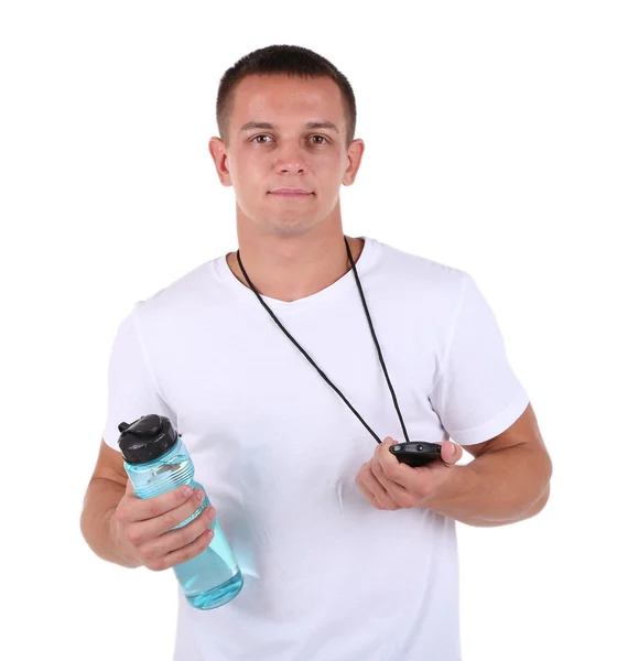 Guapo joven deportista sosteniendo botella con agua y cronómetro aislado en blanco —  Fotos de Stock