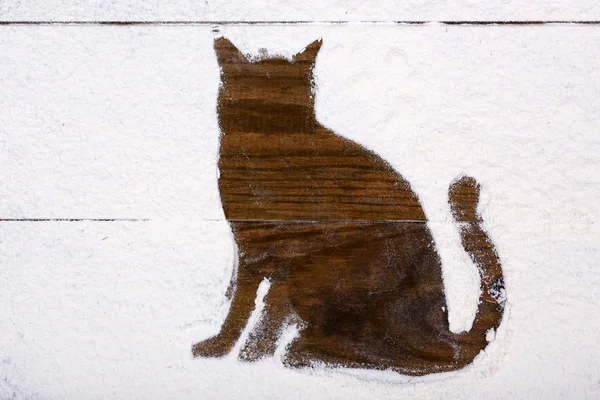 Figura del gatto fatta di zucchero in polvere su sfondo di legno — Foto Stock
