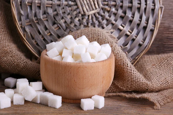 Refined sugar wooden bowl on table background — Stock Photo, Image