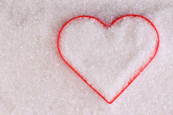 Heart covered in white sugar, close-up — Stock Photo, Image