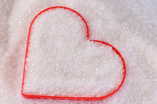 Heart covered in white sugar, close-up — Stock Photo, Image