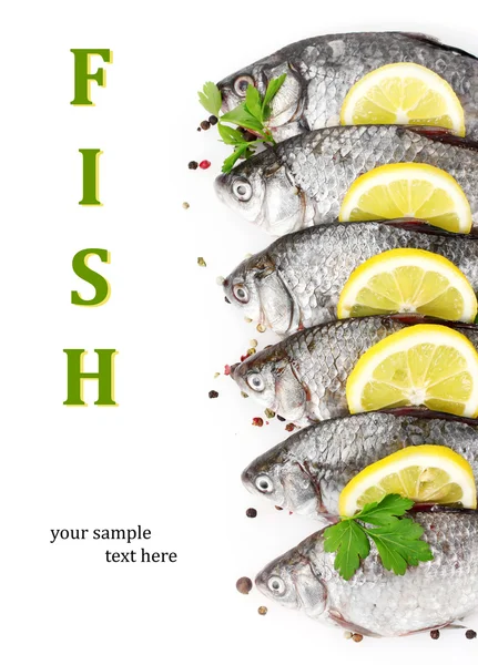 Fresh fishes with lemon, parsley and spice isolated on white — Stock Photo, Image