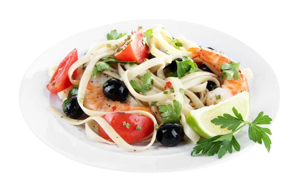 Fresh prawns with spaghetti, olives, tomatoes and parsley in a big round plate on white background isolated — Stock Photo, Image